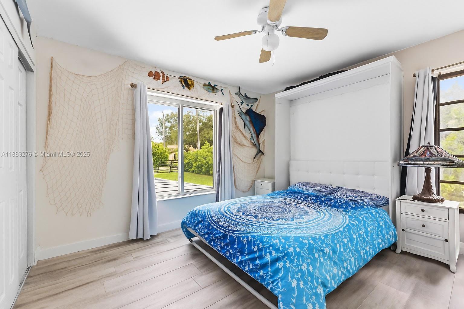 14401 Southwest 23rd Street Davie, FL 33325 - Photo 14 of 56 a bedroom with a bed and a window