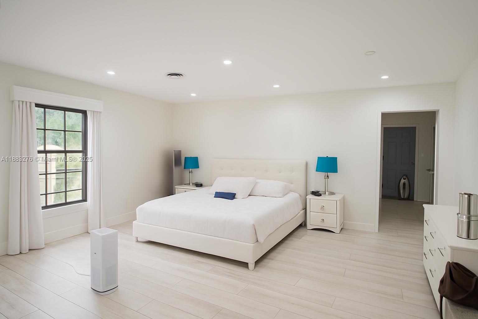 14401 Southwest 23rd Street Davie, FL 33325 - Photo 17 of 56 a bedroom with a bed and a window