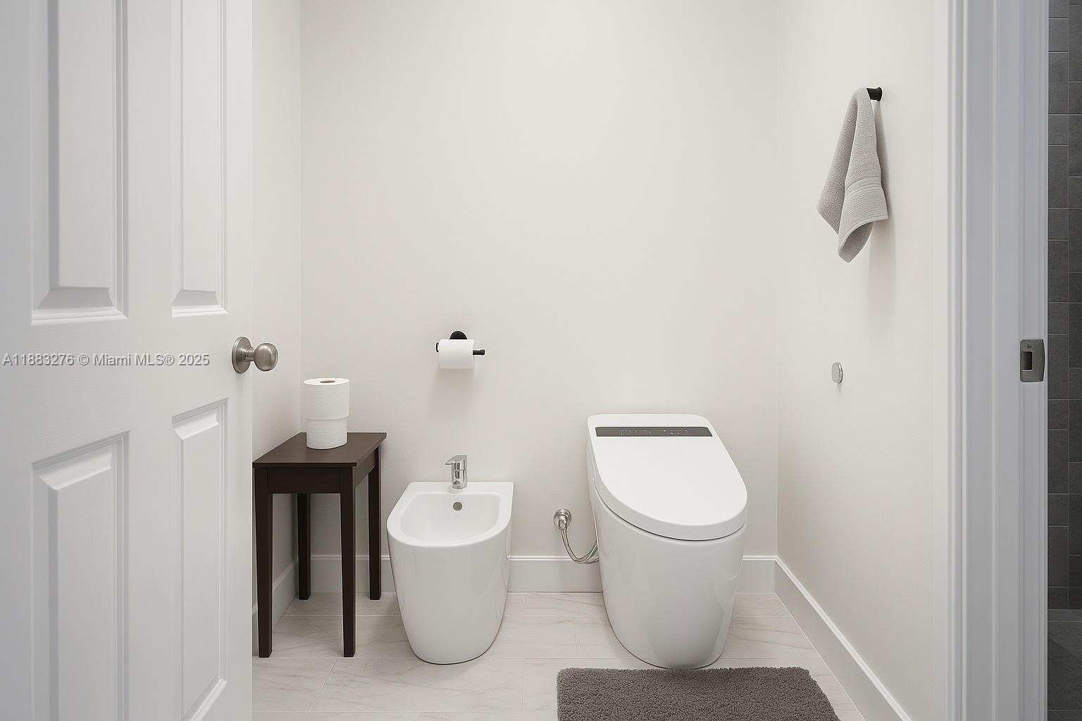 14401 Southwest 23rd Street Davie, FL 33325 - Photo 21 of 56 a white toilet sitting next to a bathroom sink