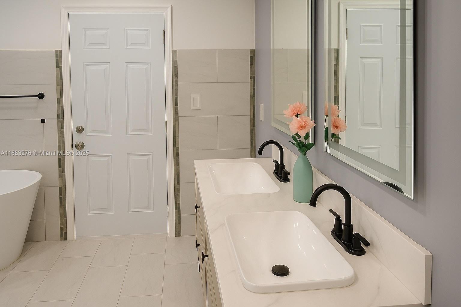 14401 Southwest 23rd Street Davie, FL 33325 - Photo 22 of 56 a bathroom with a sink and mirror