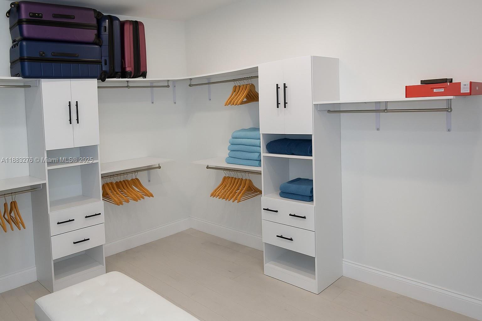 14401 Southwest 23rd Street Davie, FL 33325 - Photo 25 of 56 walk in closet with window and cabinet