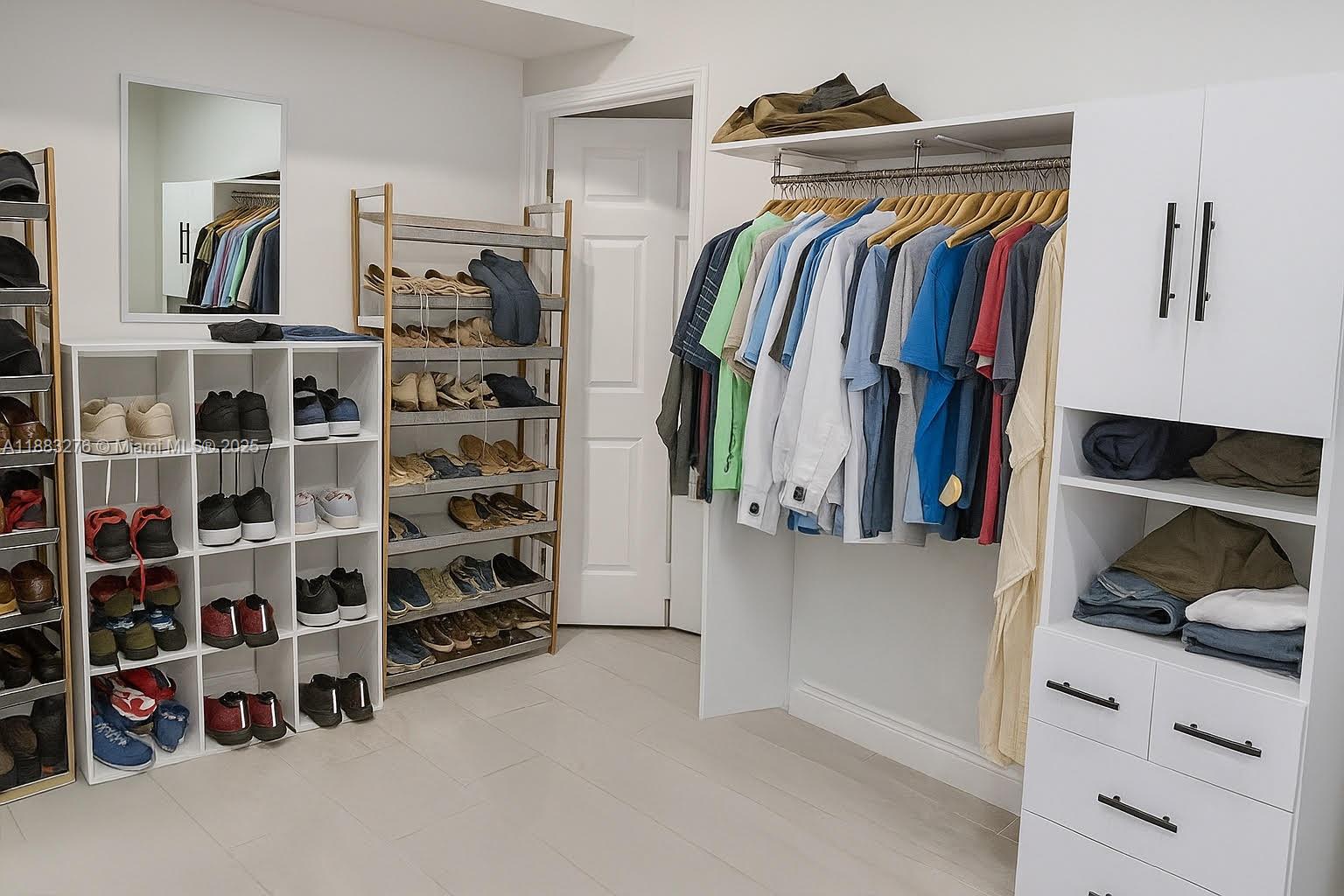 14401 Southwest 23rd Street Davie, FL 33325 - Photo 26 of 56 a view of walk in closet with clothes and shoes