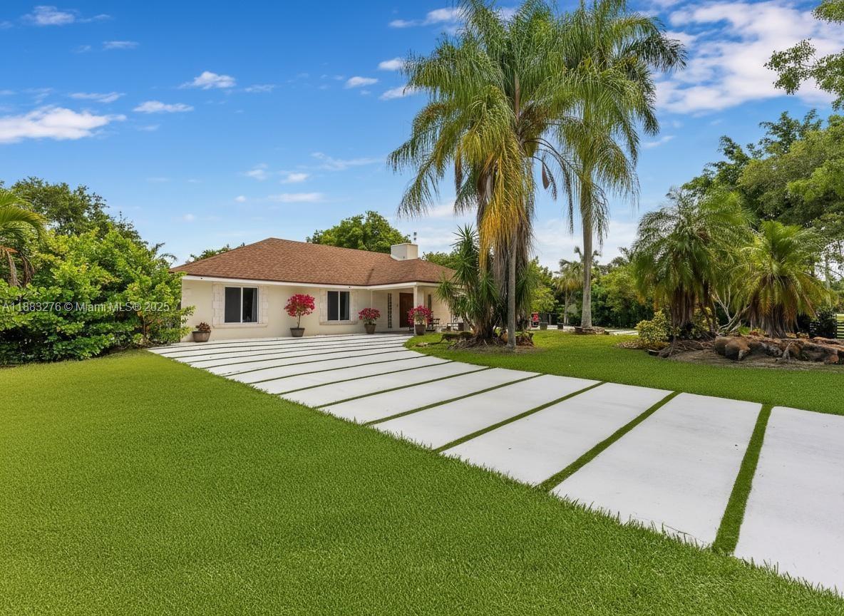 14401 Southwest 23rd Street Davie, FL 33325 - Photo 3 of 56 a front view of house with yard and green space