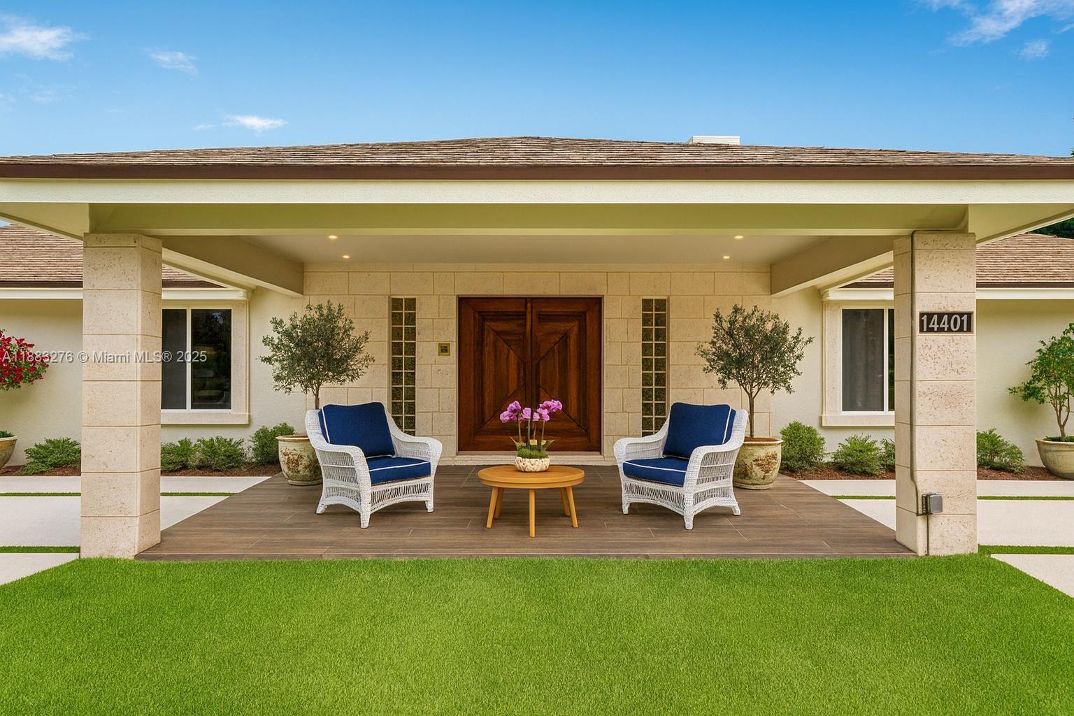 14401 Southwest 23rd Street Davie, FL 33325 - Photo 34 of 56 a chair and table in front of a building