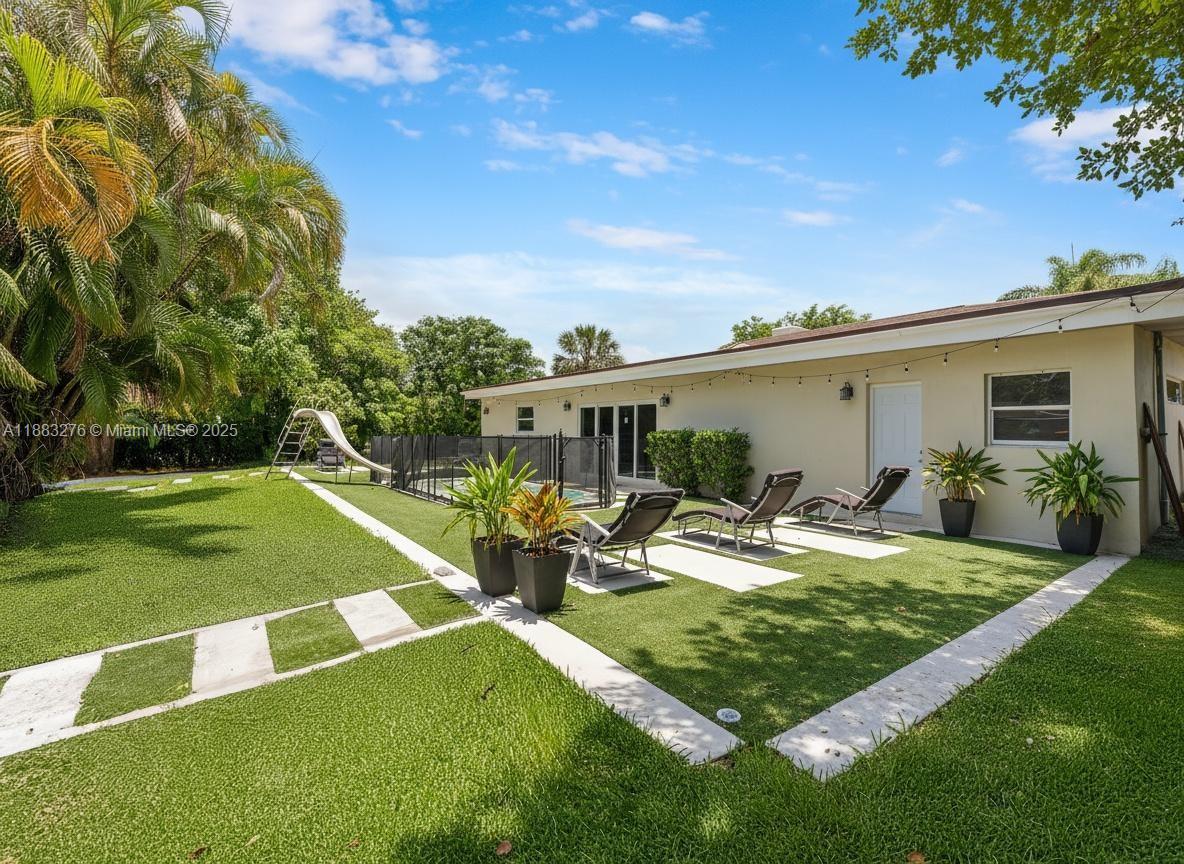 14401 Southwest 23rd Street Davie, FL 33325 - Photo 35 of 56 a view of a house with backyard