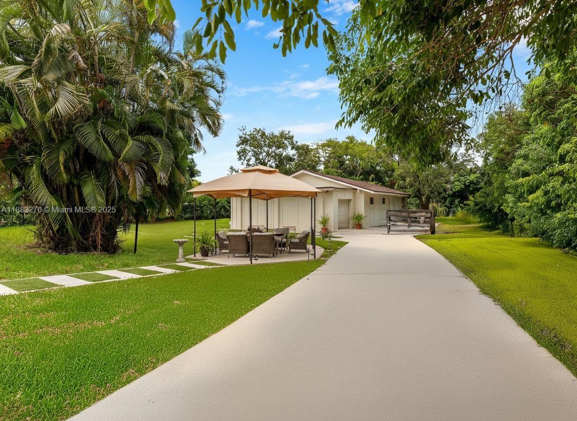 14401 Southwest 23rd Street Davie, FL 33325 - Photo 37 of 56 a view of a house with a yard