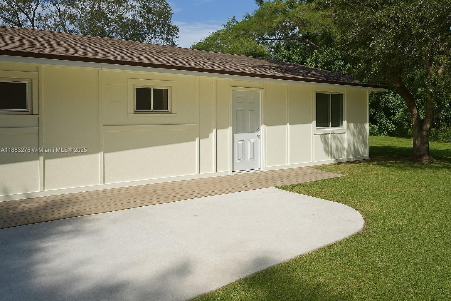 14401 Southwest 23rd Street Davie, FL 33325 - Photo 38 of 56 a view of a house with a backyard