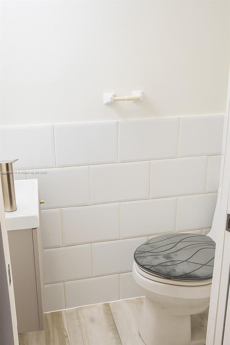 14401 Southwest 23rd Street Davie, FL 33325 - Photo 40 of 56 a bathroom with a toilet and a rug