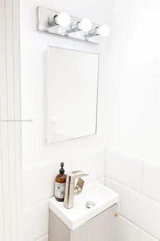 an aerial view of residential houses with outdoor space and street view