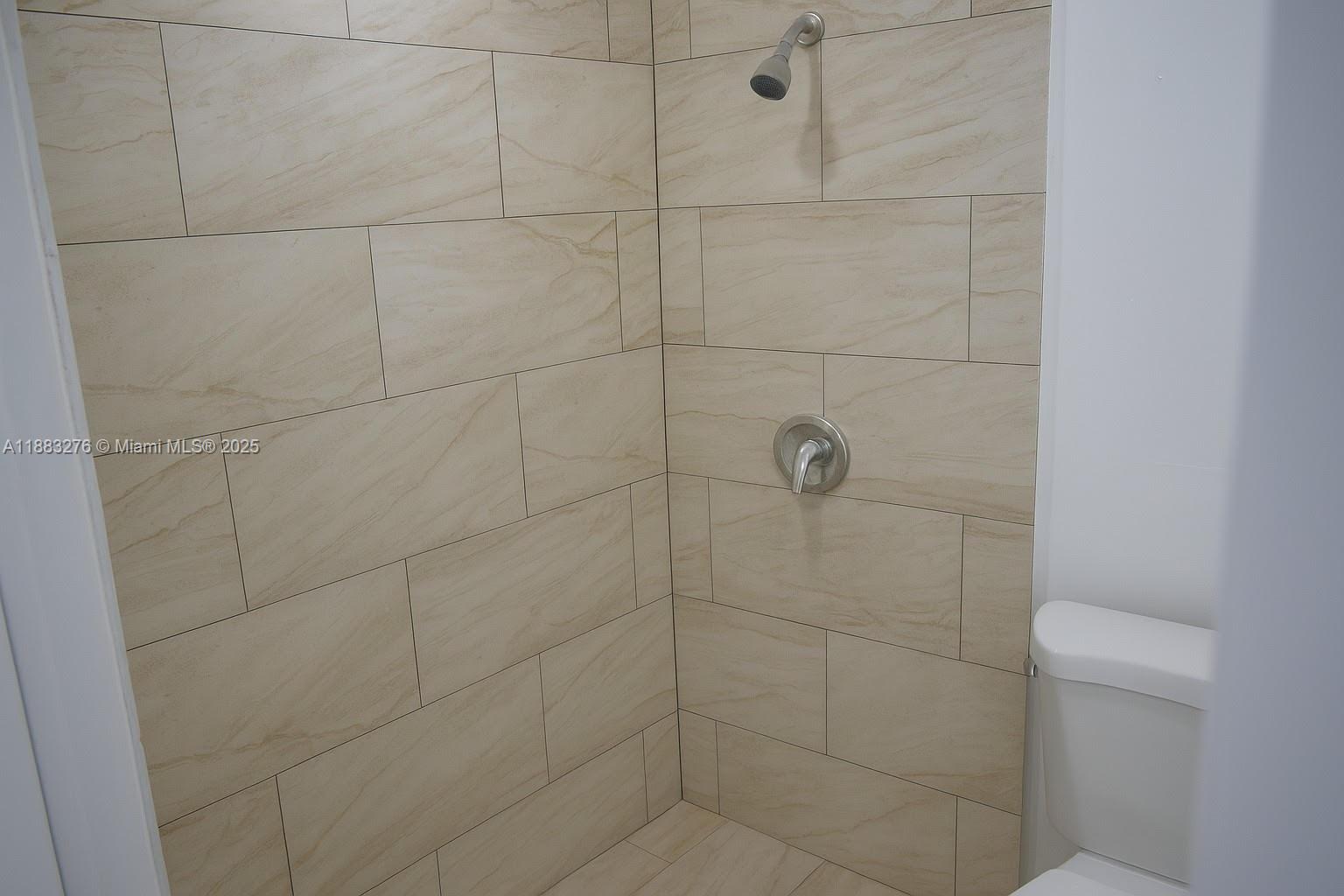 14401 Southwest 23rd Street Davie, FL 33325 - Photo 42 of 56 a bathroom with a shower