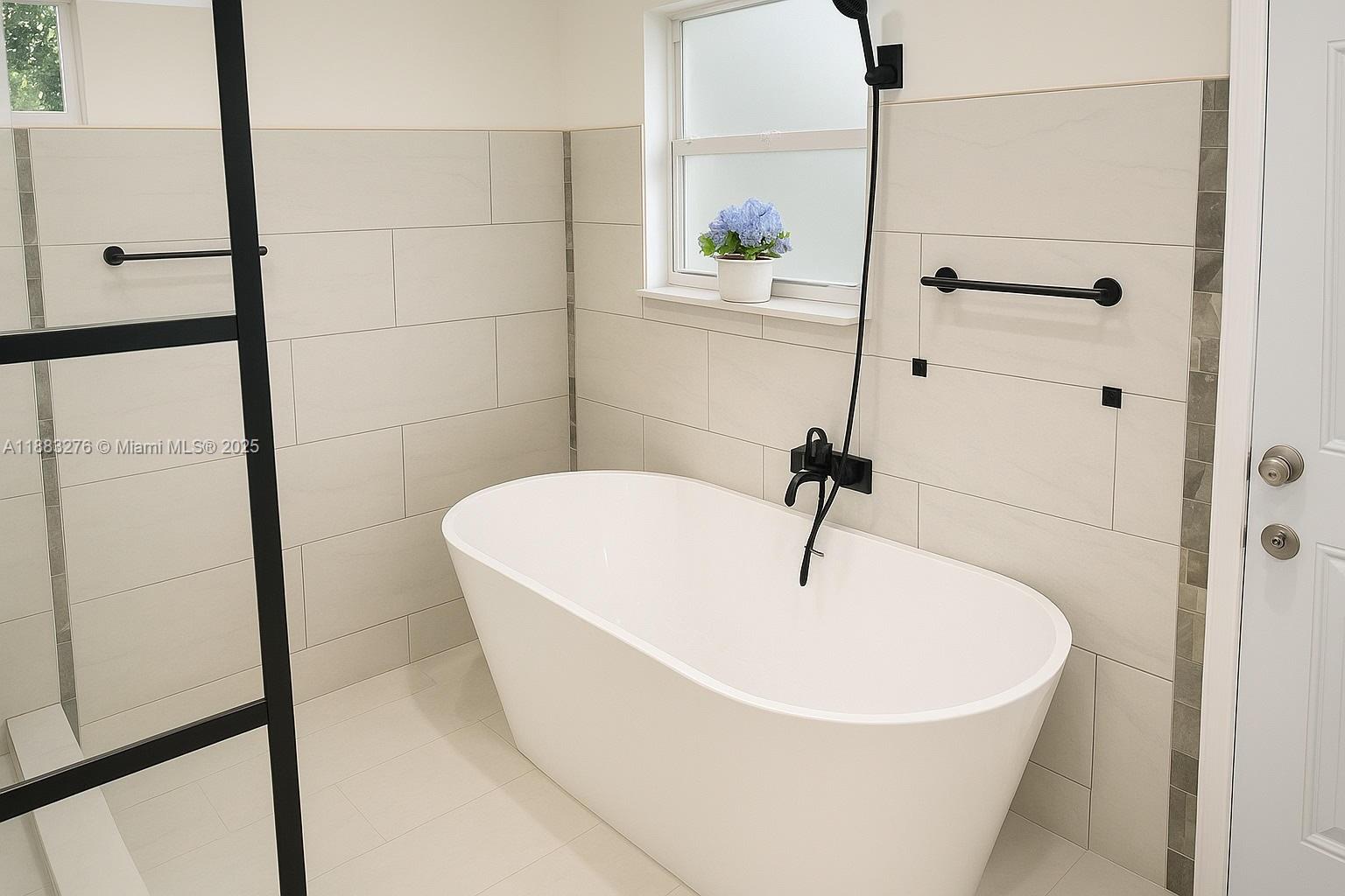 14401 Southwest 23rd Street Davie, FL 33325 - Photo 43 of 56 a white bath tub sitting next to a shower