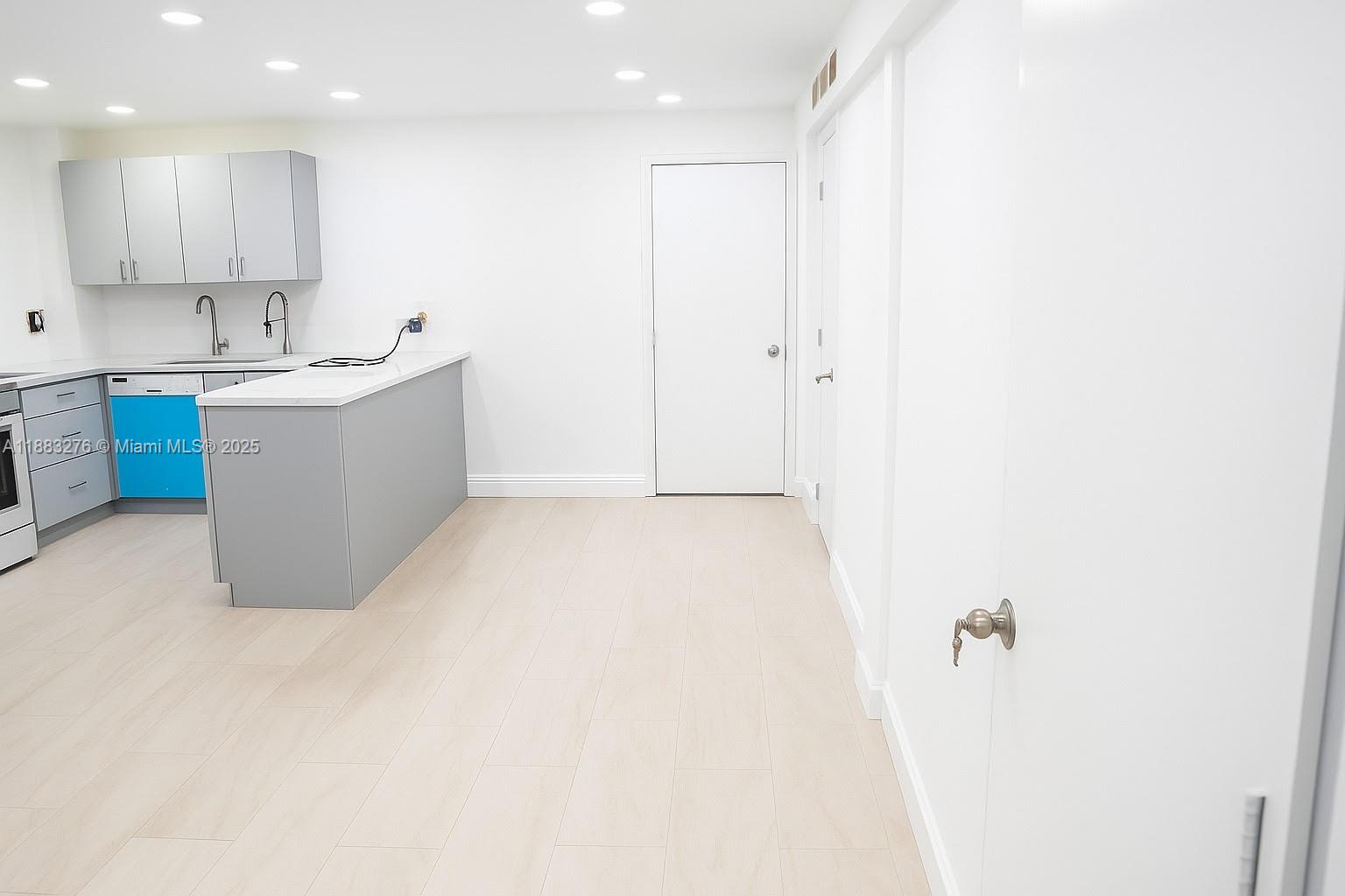 14401 Southwest 23rd Street Davie, FL 33325 - Photo 50 of 56 a view of kitchen with white cabinets
