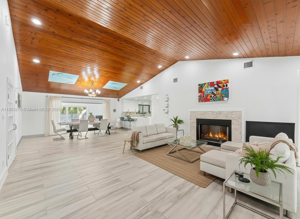 14401 Southwest 23rd Street Davie, FL 33325 - Photo 6 of 56 a living room with furniture and a fireplace