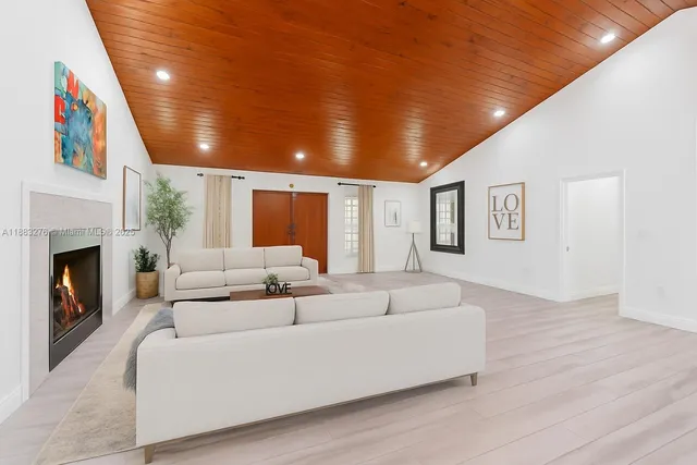 a view of a workspace with furniture and wooden floor