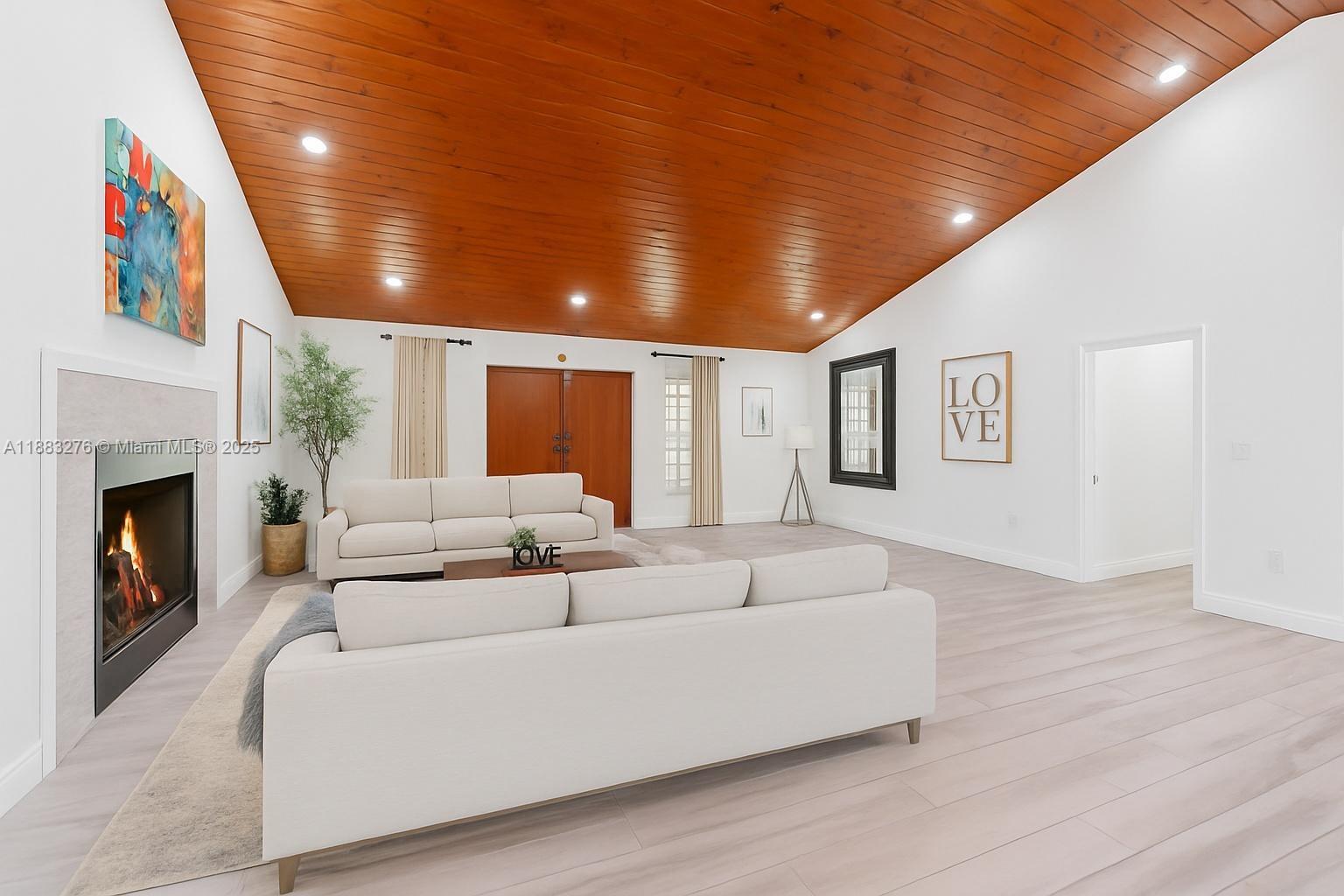 14401 Southwest 23rd Street Davie, FL 33325 - Photo 9 of 56 a living room with furniture and a fireplace