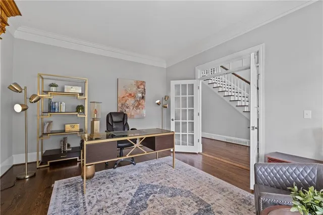 a living room with furniture a rug and a ceiling fan