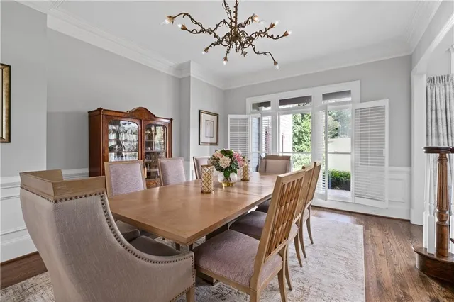 a kitchen with stainless steel appliances white cabinets and a window