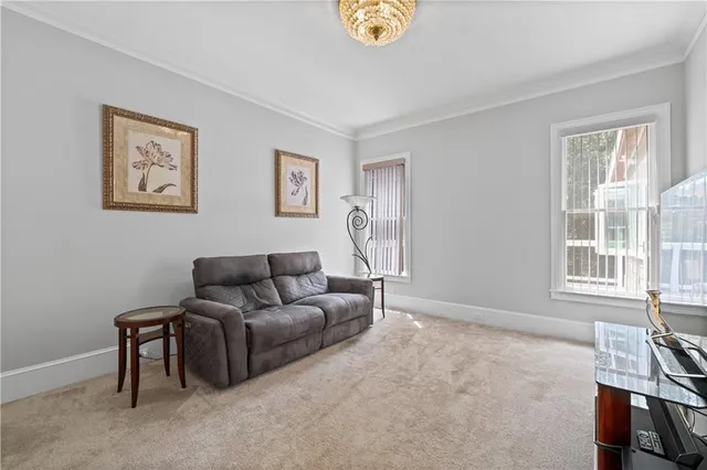 a view of a room with wooden floor and white doors