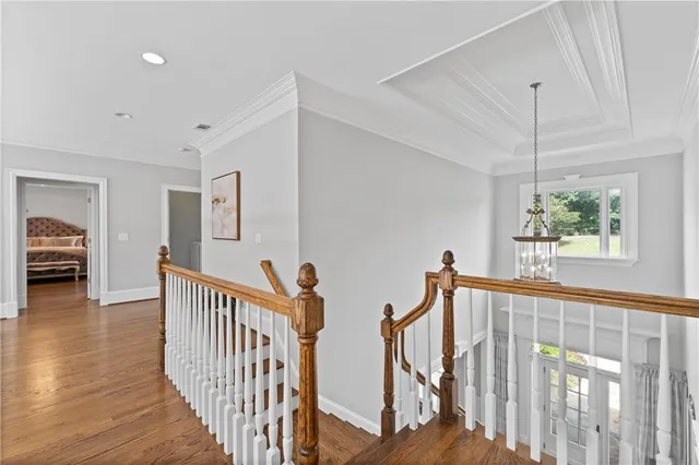 a view of an empty room with a window and a ceiling fan