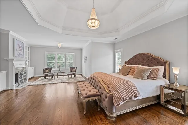 a backyard of a house with fire pit and outdoor seating