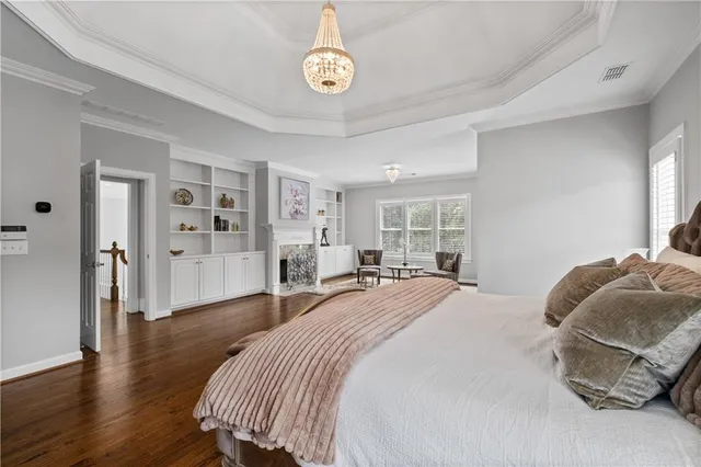a front view of a house with swimming pool and glass windows