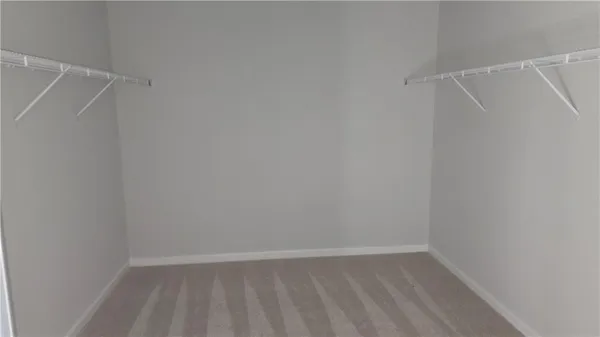 a bathroom with a double vanity sink and mirror