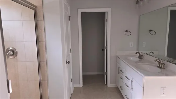 a view of hallway with wooden floor