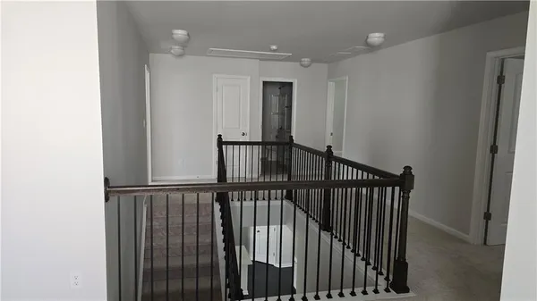 a view of a hallway with a window