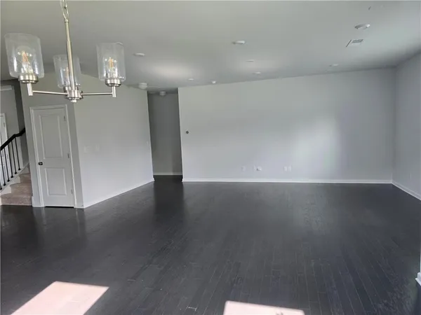 an empty room with wooden floor
