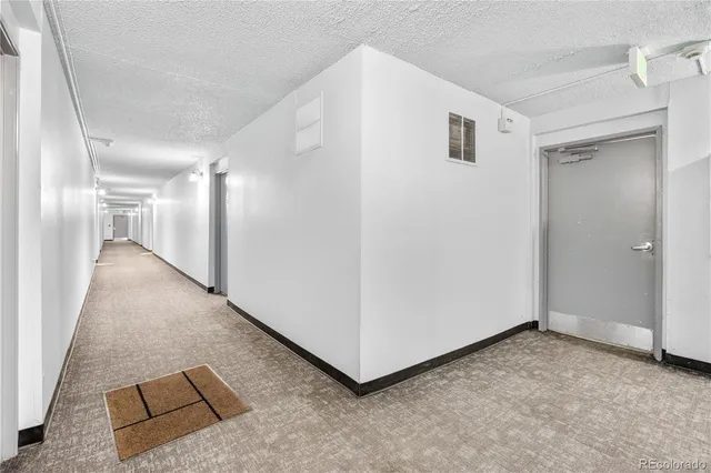 a view of a hallway with staircase