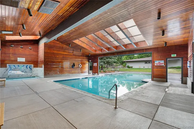 a view of a swimming pool with a patio