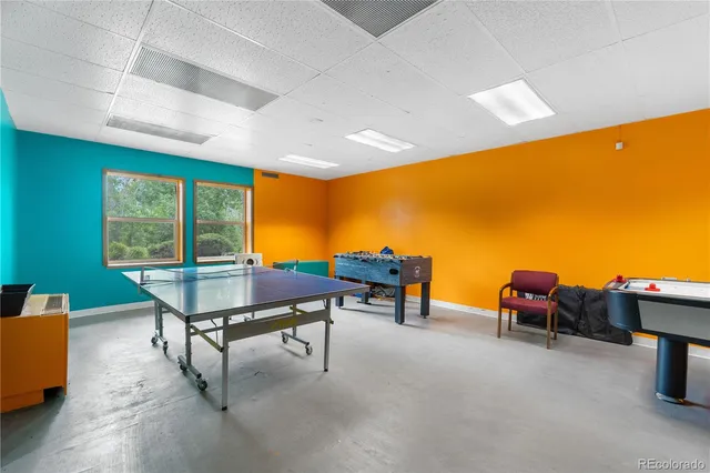 a view of a livingroom with workspace and a couch