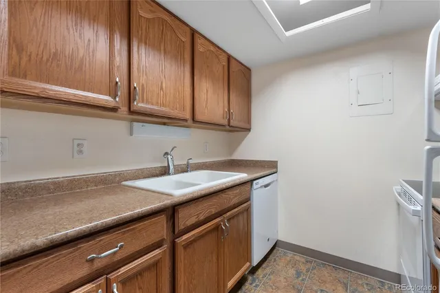 a view of a sink and cabinets