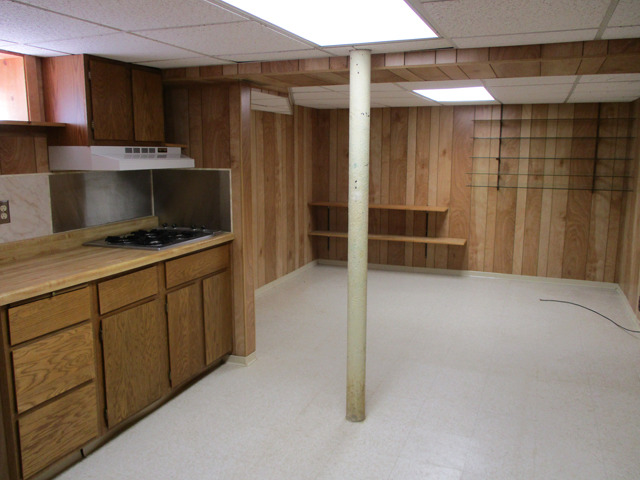 405 East Minnesota Street Spring Valley, IL 61362 - Photo 8 of 14 a kitchen with refrigerator and cabinets