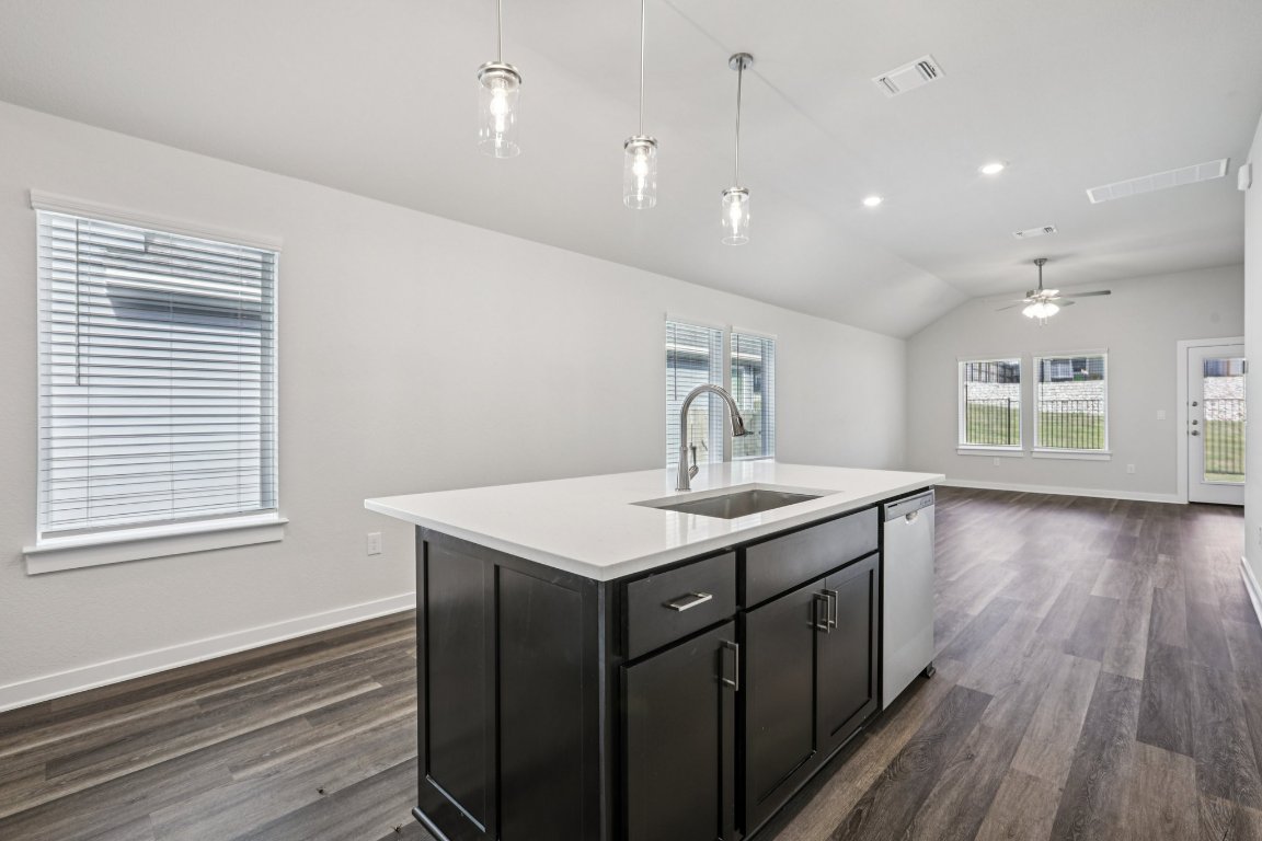 2304 Delano Drive Leander, TX 78641 - Photo 31 of 31 a kitchen with a sink and wooden floor