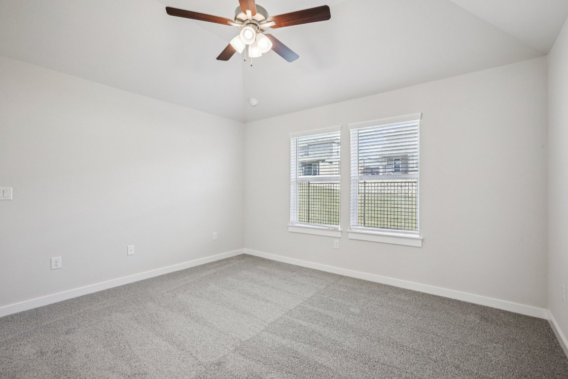 2304 Delano Drive Leander, TX 78641 - Photo 20 of 31 an empty room with a window and a fan