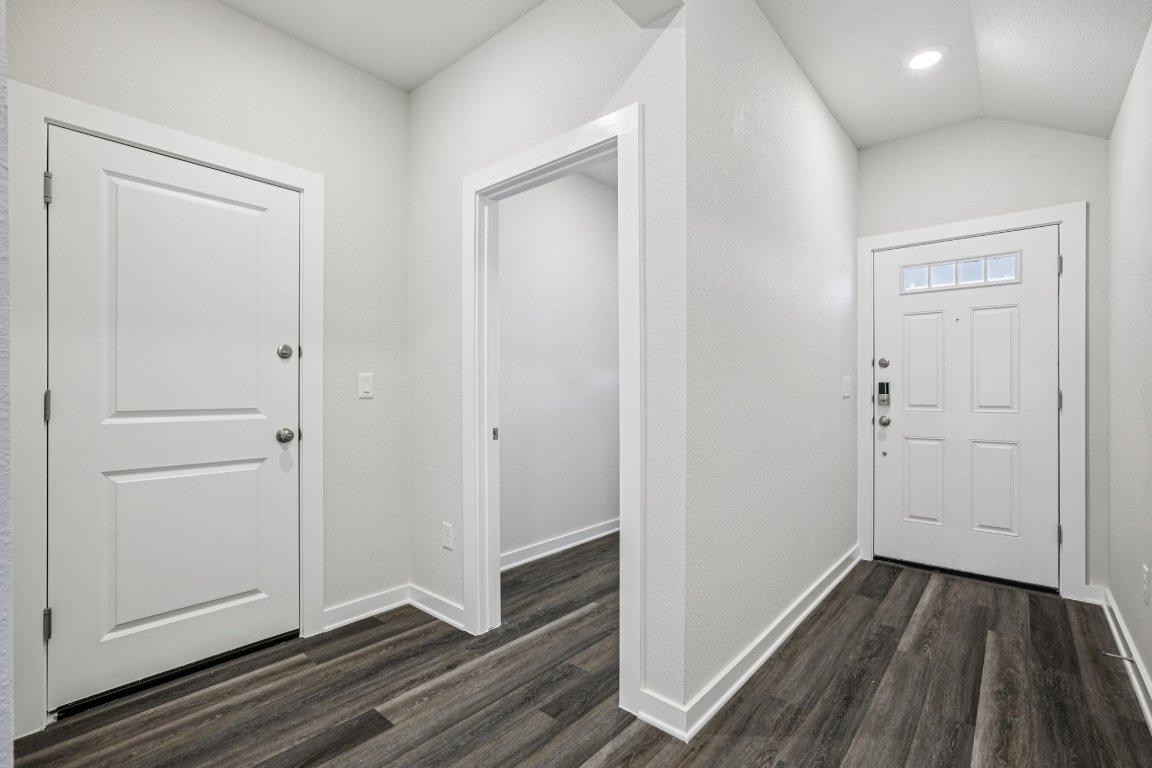 2304 Delano Drive Leander, TX 78641 - Photo 4 of 31 a view of a hallway with wooden floor