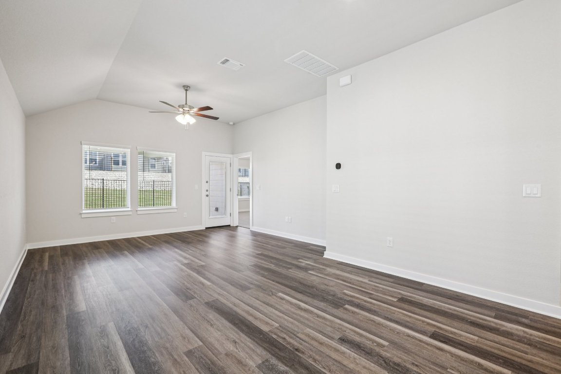 2304 Delano Drive Leander, TX 78641 - Photo 6 of 31 wooden floor in an empty room with a window