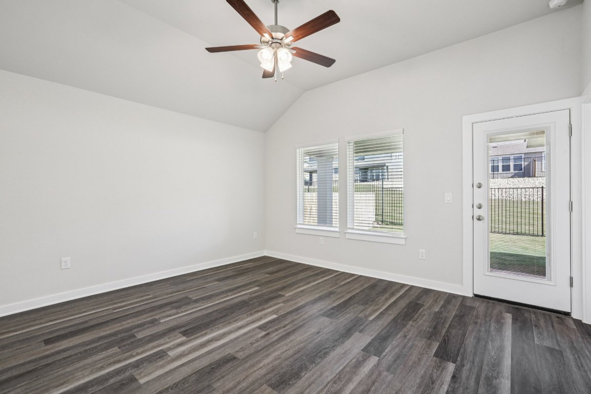 2304 Delano Drive Leander, TX 78641 - Photo 9 of 31 wooden floor in an empty room with a window