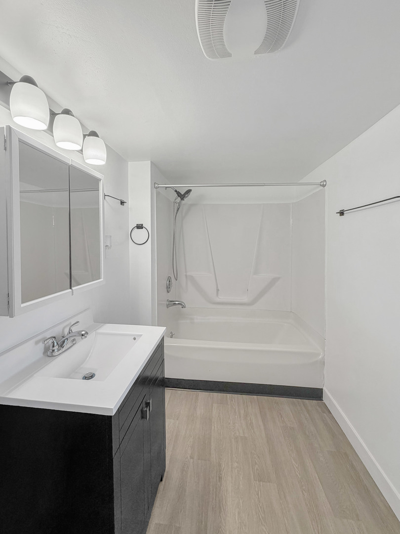 827 East Garden Street Freeport, IL 61032 - Photo 16 of 23 a bathroom with a sink and a mirror