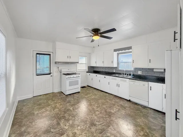 a large kitchen with cabinets