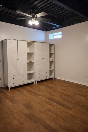 a bathroom with a toilet a sink and vanity