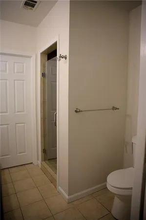 a spacious bathroom with double sink and a mirror