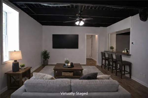 a view of empty room with wooden floor