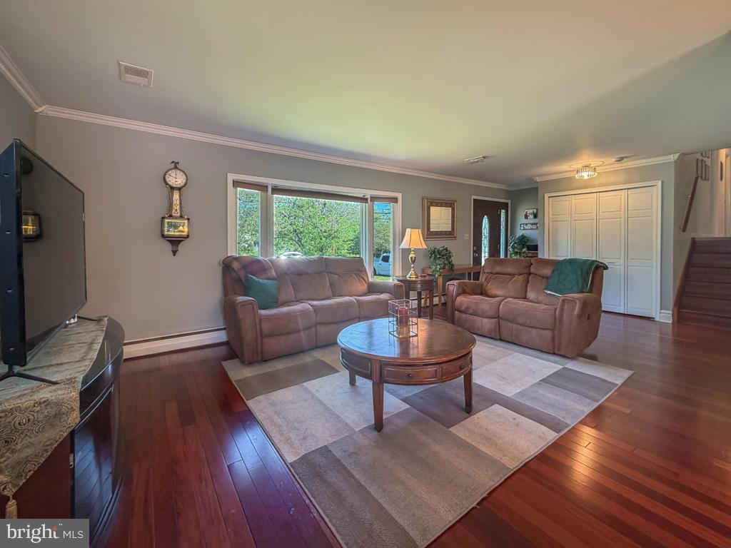 925 Big Oak Road Yardley, PA 19067 - Photo 11 of 51 a living room with fireplace furniture and a flat screen tv