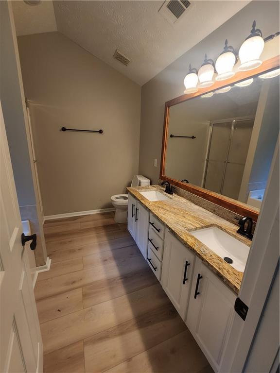 435 Butler Bridge Circle Covington, GA 30016 - Photo 6 of 25 a bathroom with a granite countertop sink and a mirror