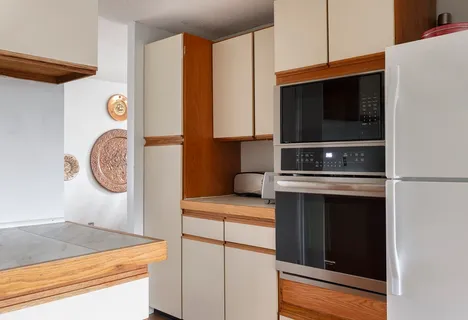 a kitchen with stainless steel appliances granite countertop a stove and a microwave