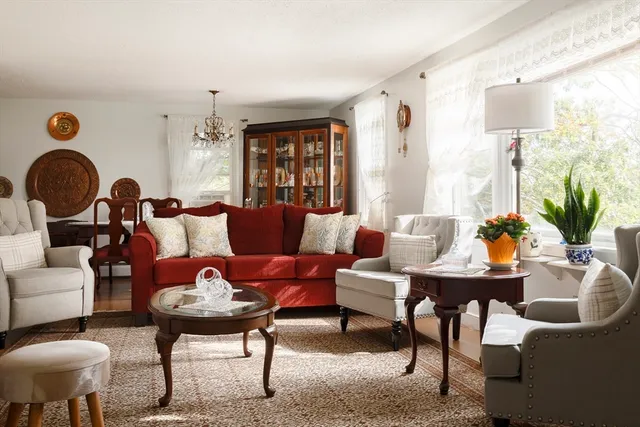 a living room with furniture and a potted plant