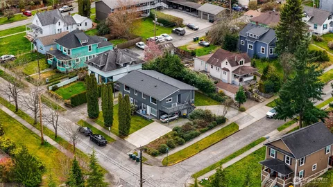 a car parked in front of white house