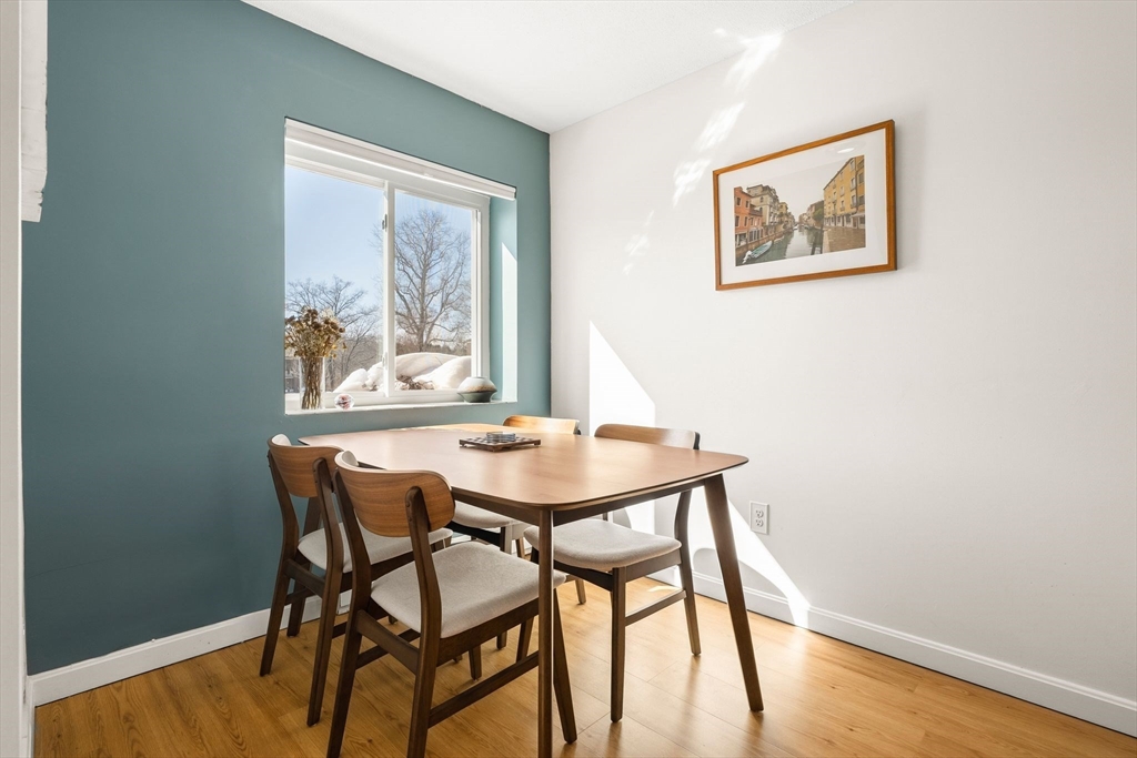 1206 Greendale Avenue, Unit 217 Needham, MA 02492 - Photo 13 of 33 a view of a dining room with furniture and wooden floor
